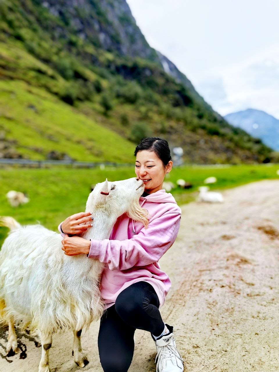Luki Song with a goat in the mountains